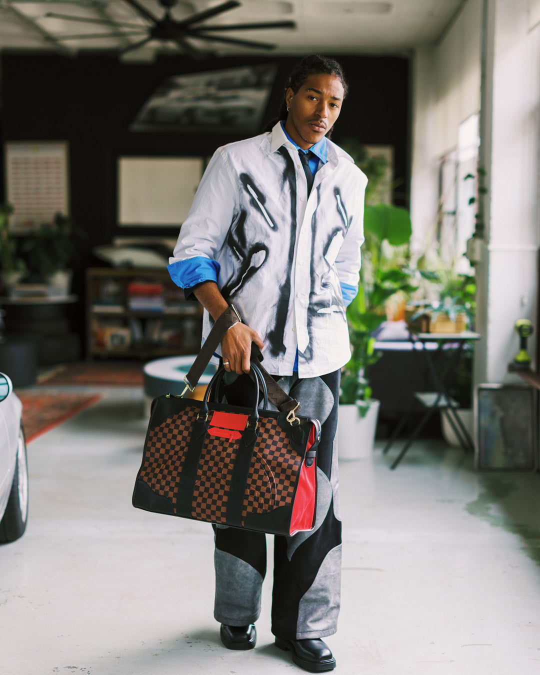 SPRAYGROUND® DUFFLE RED REDEMPTION PYRAMID DUFFLE