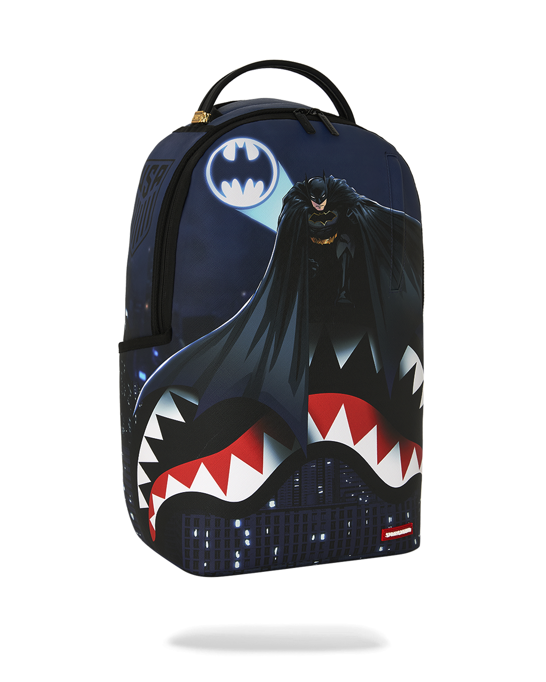 SPRAYGROUNDÂ® BACKPACK USSF x DC BATMAN OVER SHARKMOUTH BACKPACK