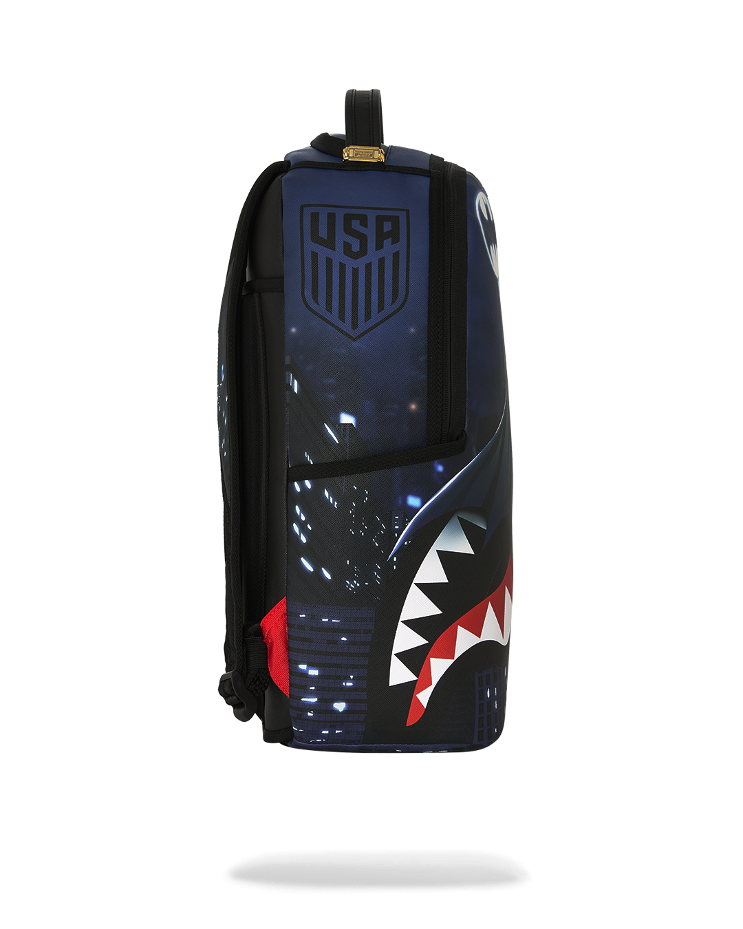 SPRAYGROUNDÂ® BACKPACK USSF x DC BATMAN OVER SHARKMOUTH BACKPACK