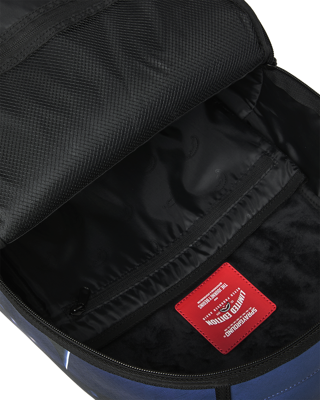 SPRAYGROUNDÂ® BACKPACK USSF x DC BATMAN OVER SHARKMOUTH BACKPACK